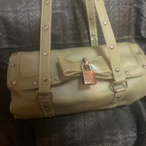 Mint Cream jelly Handbag with Lock Detail

Bag is pre loved and it shows.